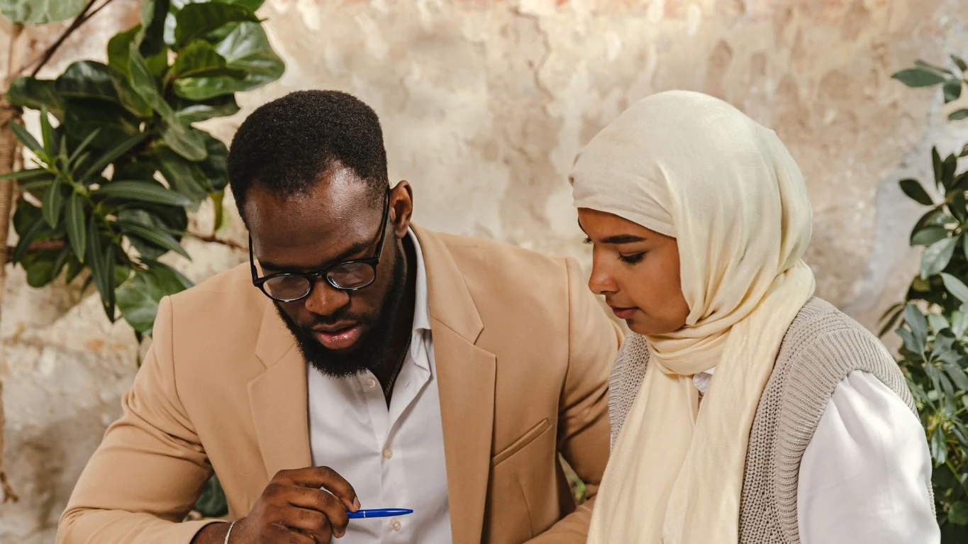 Property buyers reviewing plans and materials together